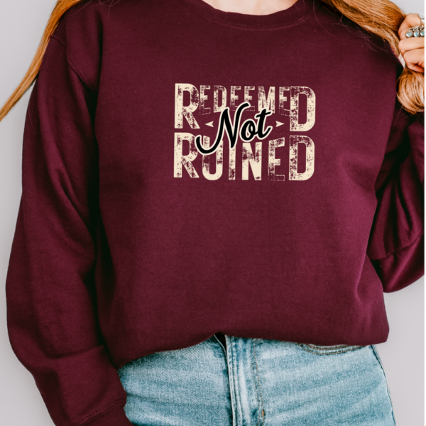 Unisex Christian Sweatshirt. Maroon-Redeemed Not Ruined